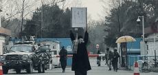 Afghan girl protesting alone