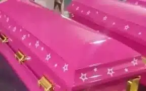Funeral Home selling Barbie hot pink themed coffins