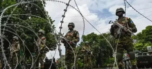 India has imposed a curfew in border areas near Bangladesh amid political turmoil in Dhaka